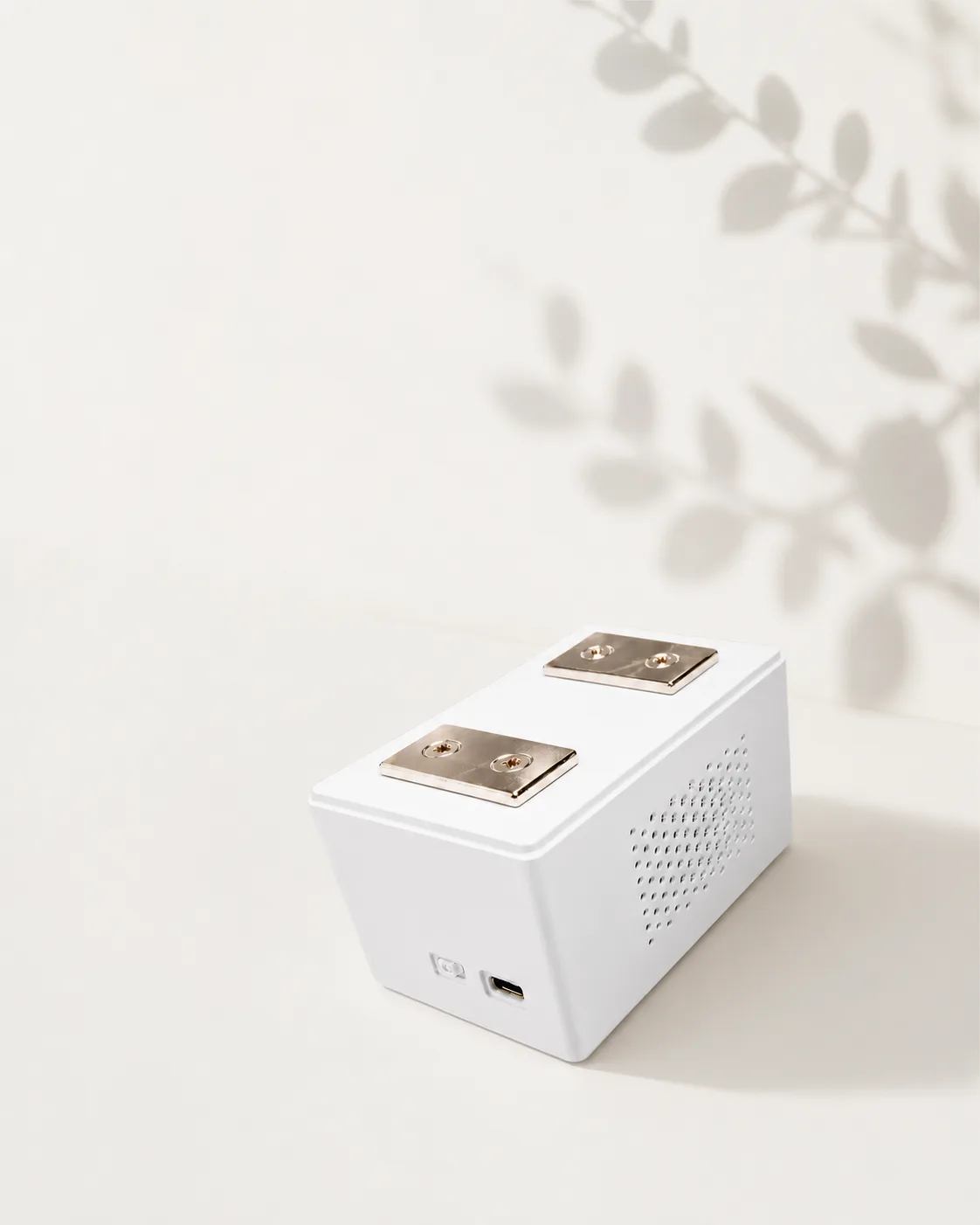 The BedDot sensor with its two mounting magnets
