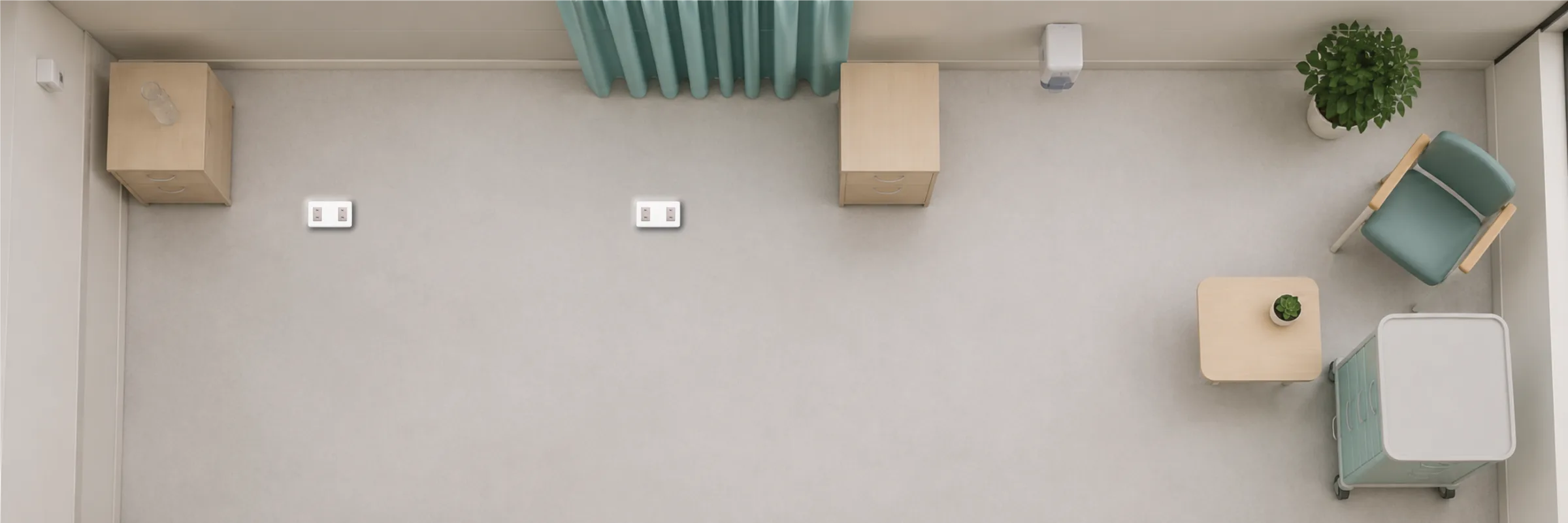 Top-down view of an empty clinical room with BedDot devices on the floor